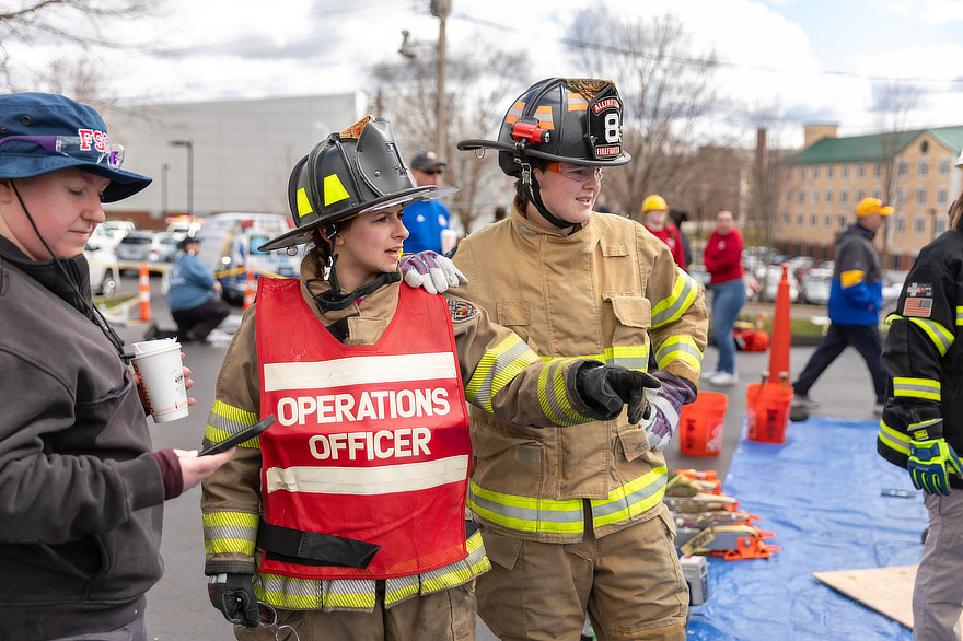 Fire students in firefighter gear during drill
