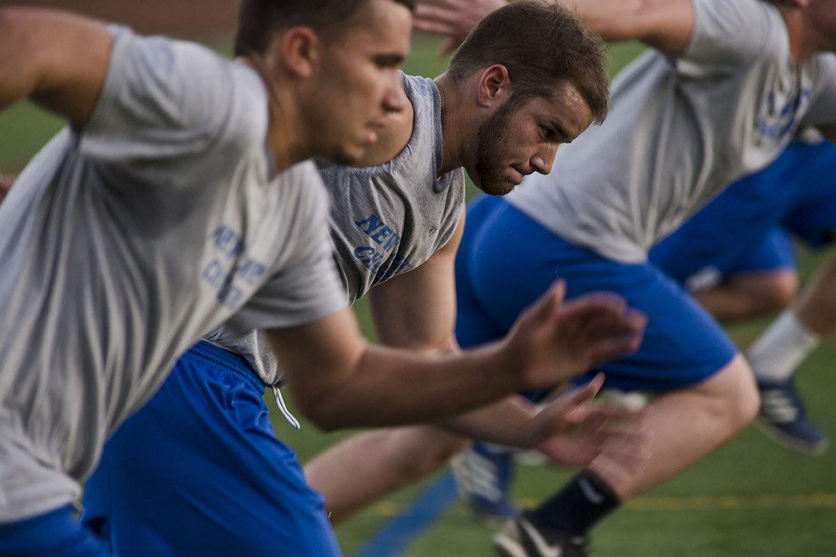 Student-athletes run sprints.