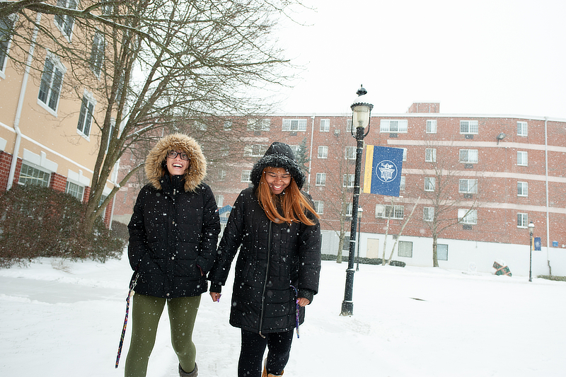 Students walking through snowy campus