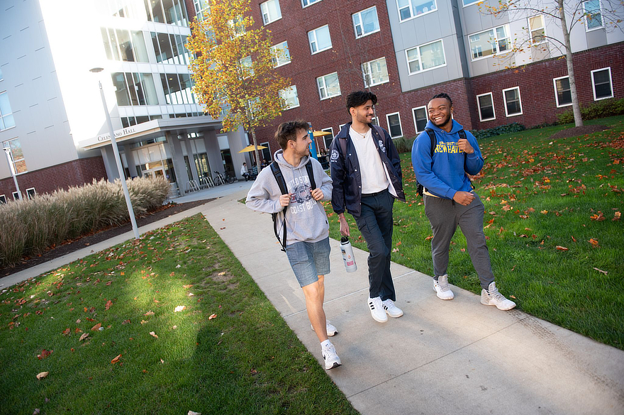 Students walking on campus in fall