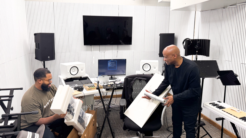 Dr. Horton and Travis Scott, the in house producer,  setting up the new music studio made possible thanks to the Mellon Foundation Grant. 