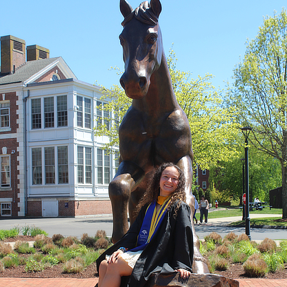 Giavanna A. Cucarese ’25, ’26 M.S. on Charger statue