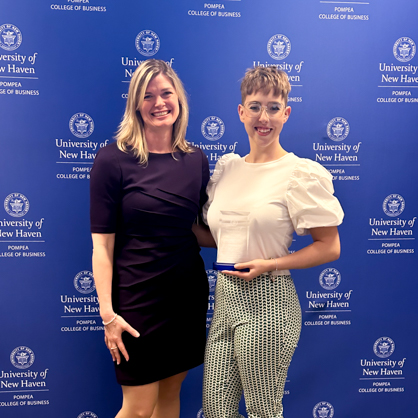 Courtney McNelis, '23 (right) receiving the Outstanding Achievement Award in Human Resource Management 2023 next to Jan Louise Jones, Ph.D. (left)