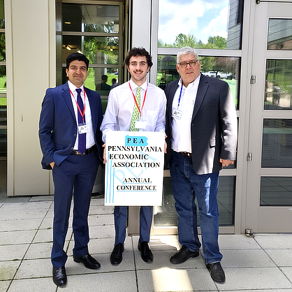 Jacob Carson ’25 (center) and Saurabh C. Srivastava ’25 M.S. (left) presented their research with guidance from faculty mentor Dr. Armando Rodriguez (right)