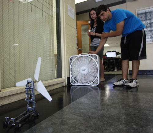 Karen Yang, 17 and Andrew Cappola, 17, test a wind-powered vehicle