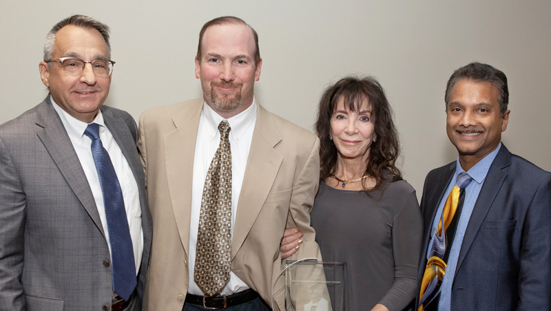 Photo of Provost Dan May, William (Bill) O'Brien's son, Sean, and wife, Jean, and Dean Ron Harichandran