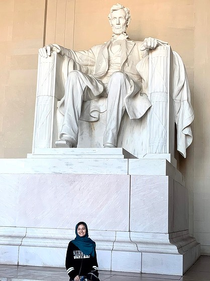 Image ofAyah Abdallah ’21 M.S. at the Lincoln Memorial in Washington, D.C.