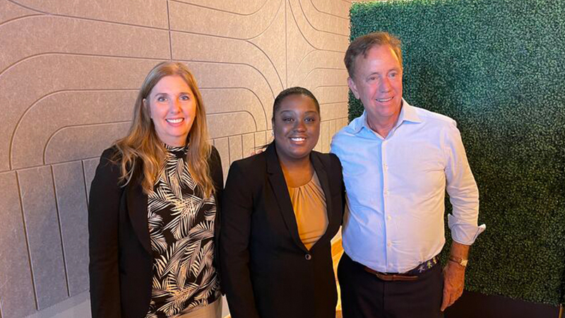 Left to right: 
Dr. Kelli-Marie Vallieres, vice chair of the Governor’s Workforce Council; Fredlyne Antoine ’24; and Gov. Ned Lamont.

