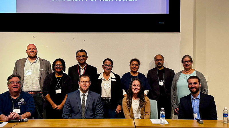 Panelists (front row): Harris Weisman, Paulius Laukaitis, Samantha Konsewicz, and David Palmbach, with conference attendees.