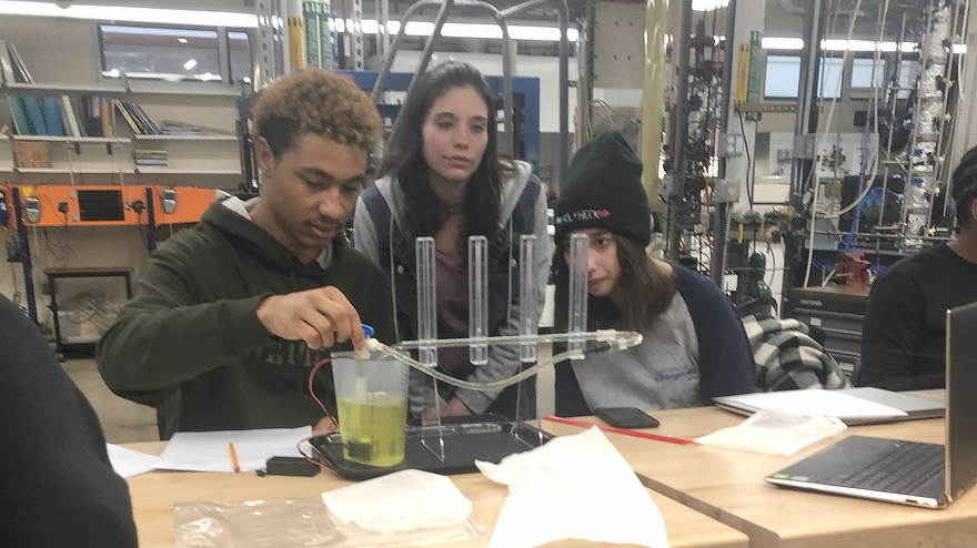 Sophomore students working on a project