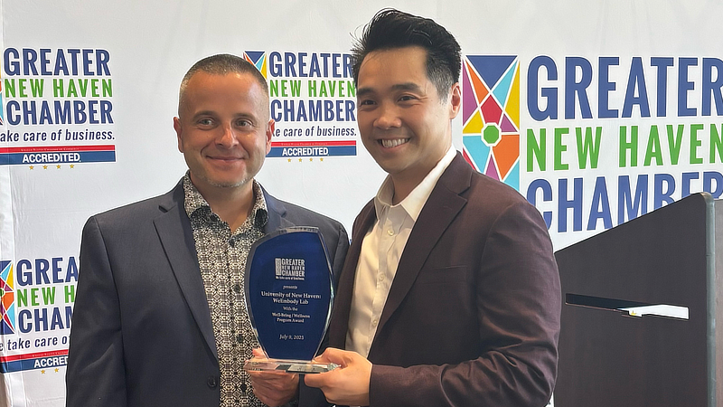 Dr. Alvin Tran accepted the Well-Being/Wellness Program Award on behalf of the University of New Haven's We Embody Lab.