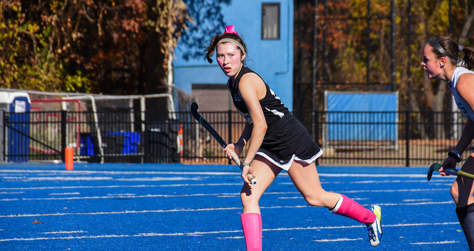 Woman playing lacrosse
