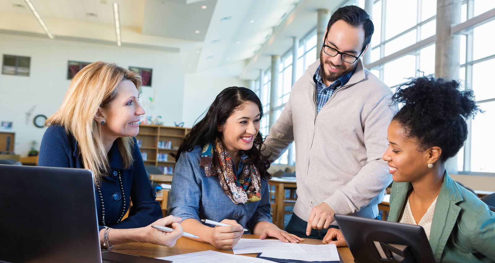 Teachers collaboration. Enjoyable College Education with Notebook. Collaborative teaching.