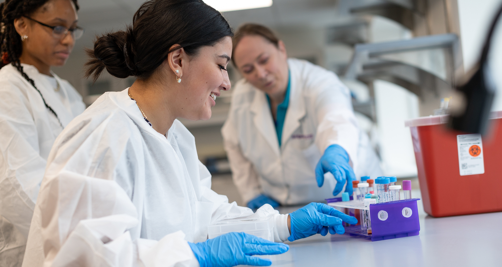 A Medical Laboratory Science student working in a lab.