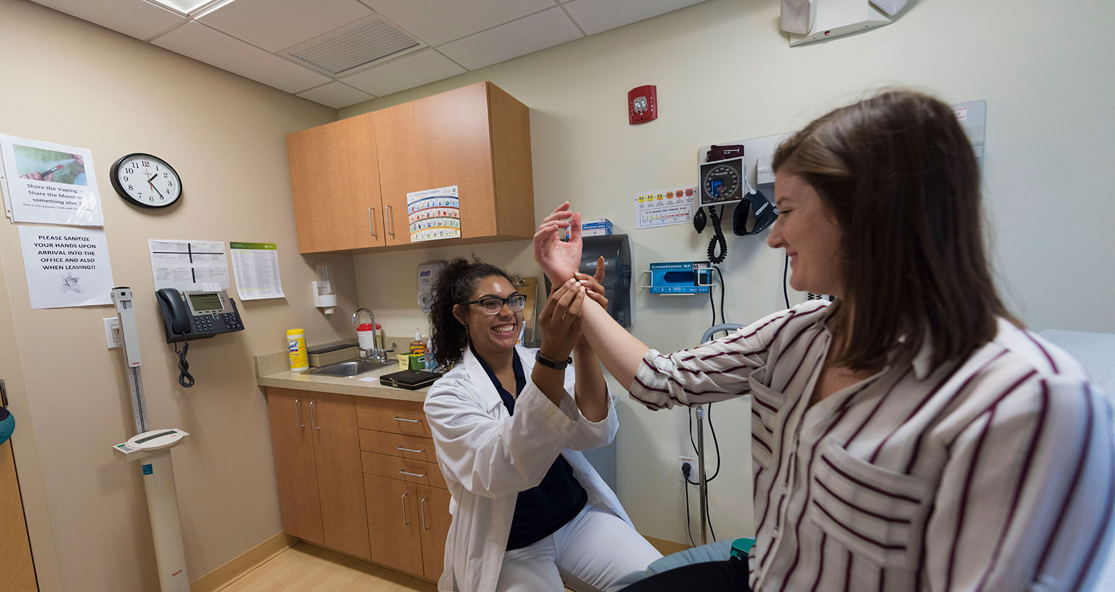 Health Sciences students taking a pulse