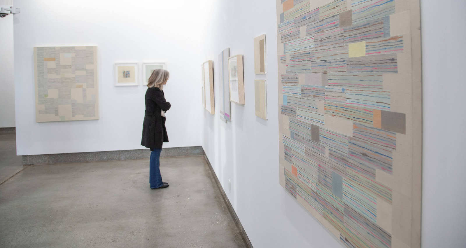 Woman looking at art in gallery