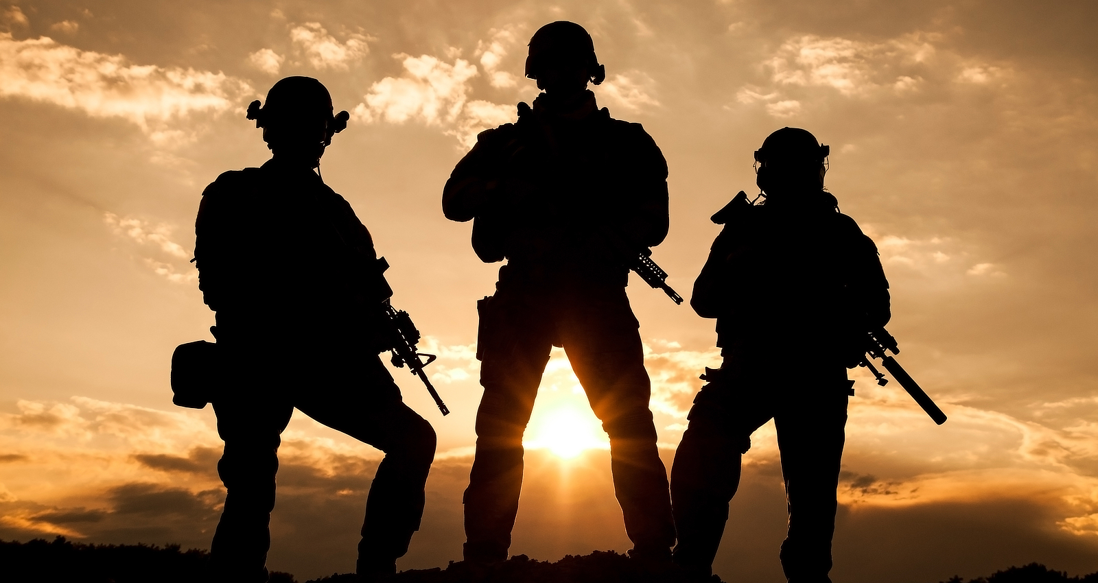 Silhouette of soldiers on a hill
