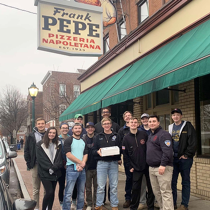 Nolan Heiden ’23 (far left, back) with members of the Fire Science & Emergency Management LLC at Frank Pepe Pizzeria Napoletana in New Haven.