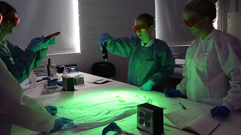 Students used alternate light sources and Luminol to reveal hidden biological evidence.