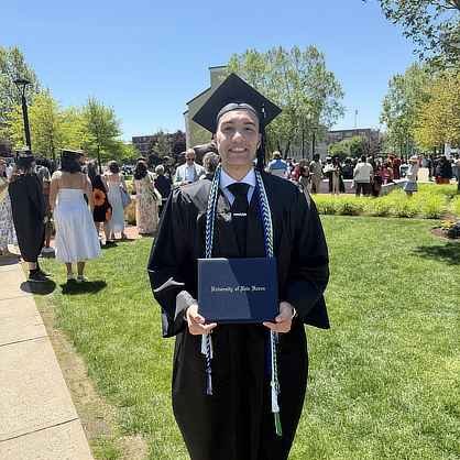 Eren Sarikaya ’26 with diploma