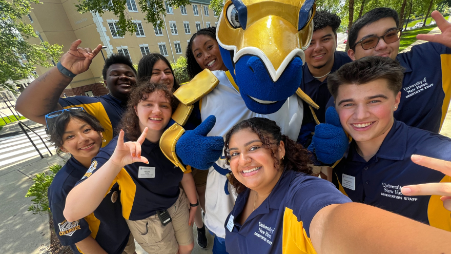 Resto (front, center) supports incoming students at Orientation