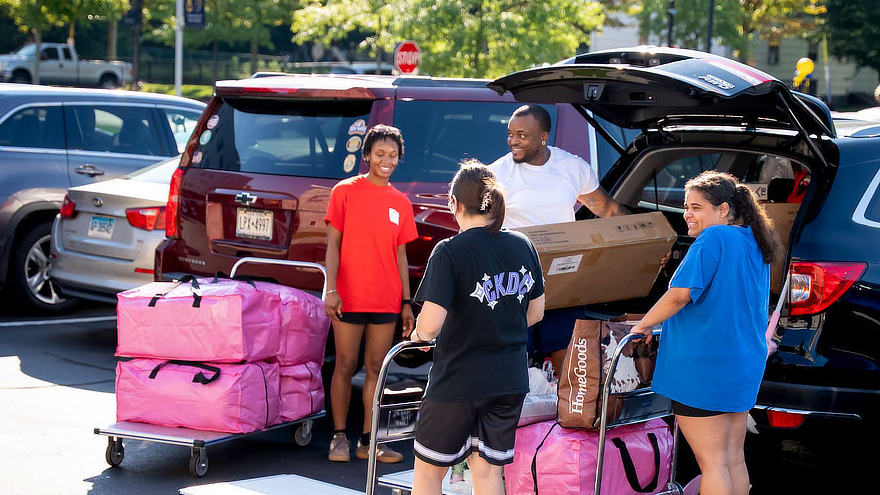Families unloaded cars filled with belongings as new Chargers settled into their residence halls.