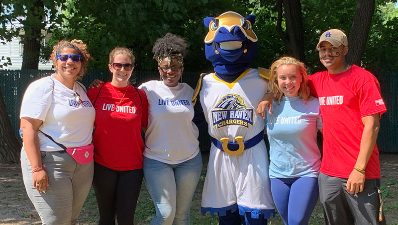 Image of University of New Haven students and Charlie