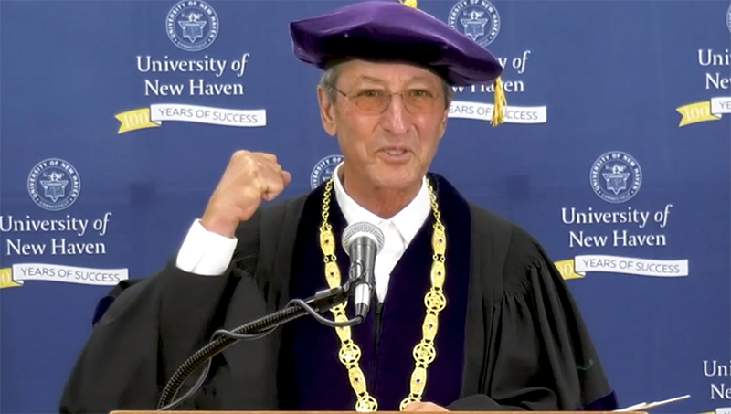 President Kaplan speaking at podium