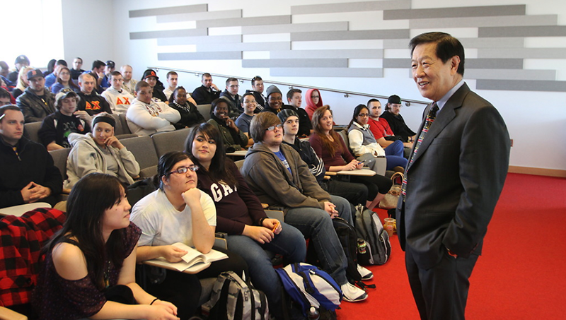 Dr. Henry Lee speaking in front of students at the University of New Haven.