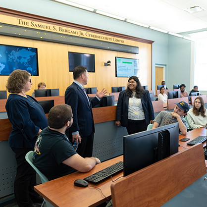 Attorney General William Tong with faculty and students in the University’s Samuel S. Bergami Jr. Cybersecurity Center.