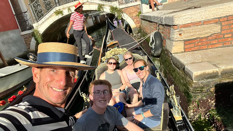 Nyle Hopping ’26 (center) and his family on a gondola in Venice.