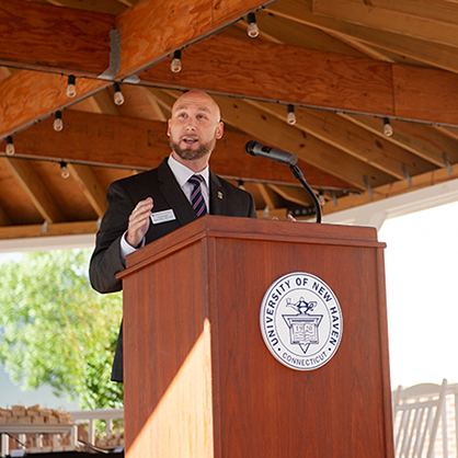 Ryan Noonan ’20, ’23 M.S. speaking at the University’s Military & Veteran Center grand opening.