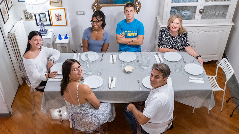 Fransheli Ventura ’23 and Julia Sosnowski ’23 had dinner with a local family while studying abroad in Prato, Italy.
