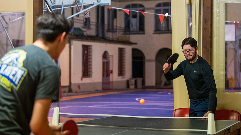 Sean Flatley ’23 plays table tennis during a sports night event.