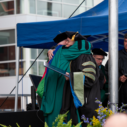 Aaron S. Marks ’24 embraces his father, Brian A. Marks , J.D., Ph.D. at Commencement