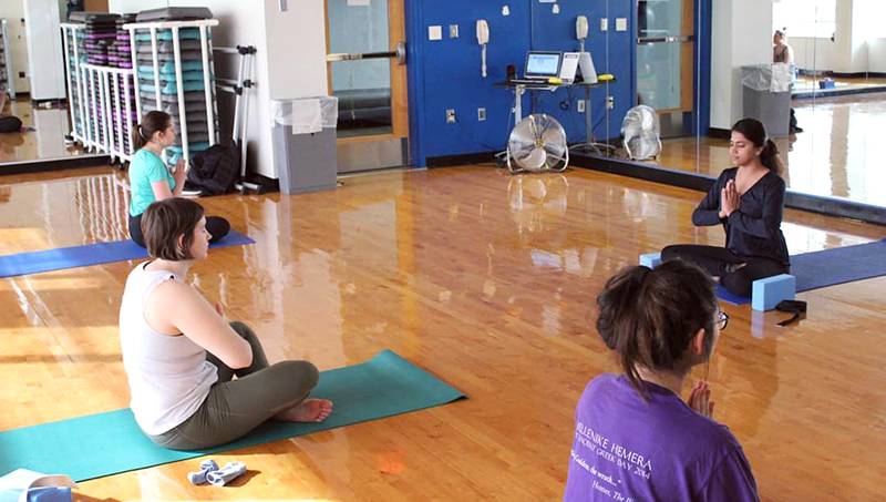 Ananya Khatri teaching yoga at ChargerRec.