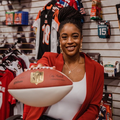 Ayana Duncanson holding a football.