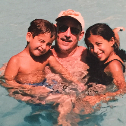 Max Giaccone '14 and his sister Alex swim with their father.