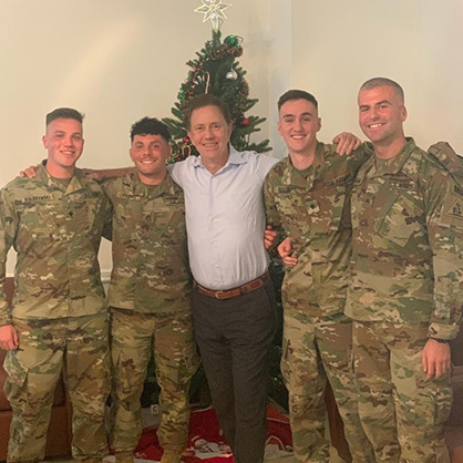 Brian Nalezynski ’22 (left) with his fellow servicemembers and Gov. Ned Lamont in Cuba.