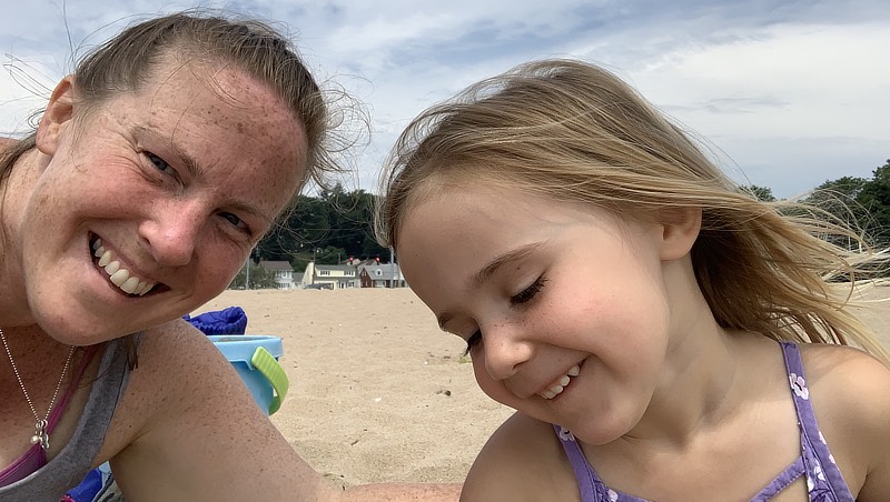 Paige Bartels and her daughter at the beach.