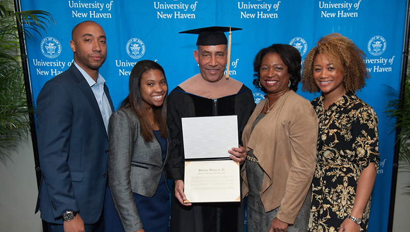 Shelley Stewart Jr. ’90 EMBA, ’16 (center), Ann Stewart (second from right), and their family.