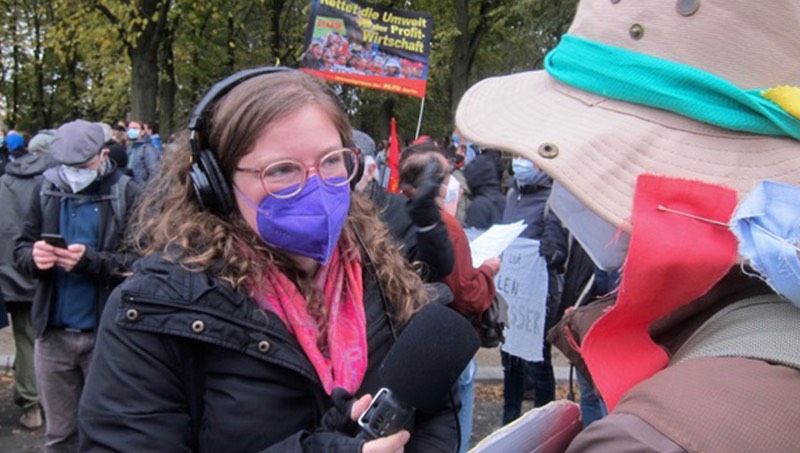 Image of Sylvia Cunningham reporting at a climate strike.