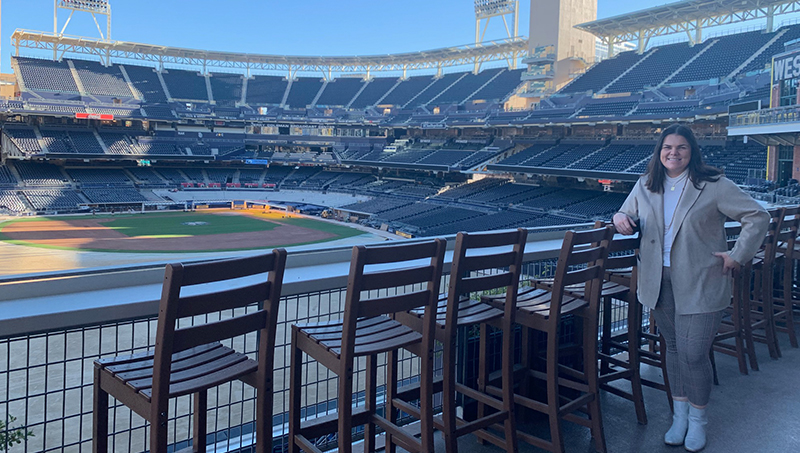 Tess Bloom stands in the bleachers of Petco Park.