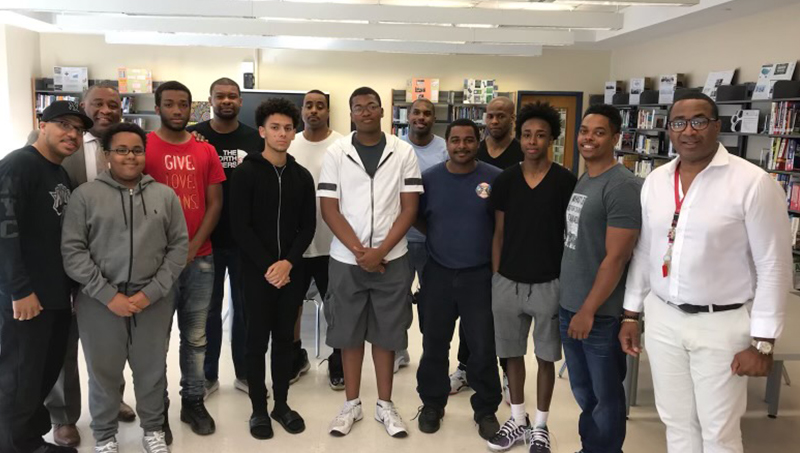 Group image of Darryl Mack ’91 (right) and his students.