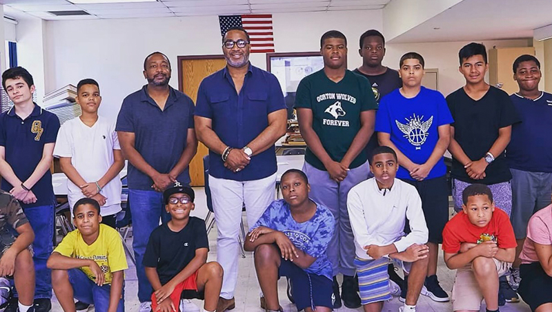 Group image of Darryl Mack ’91 (center) and his students.