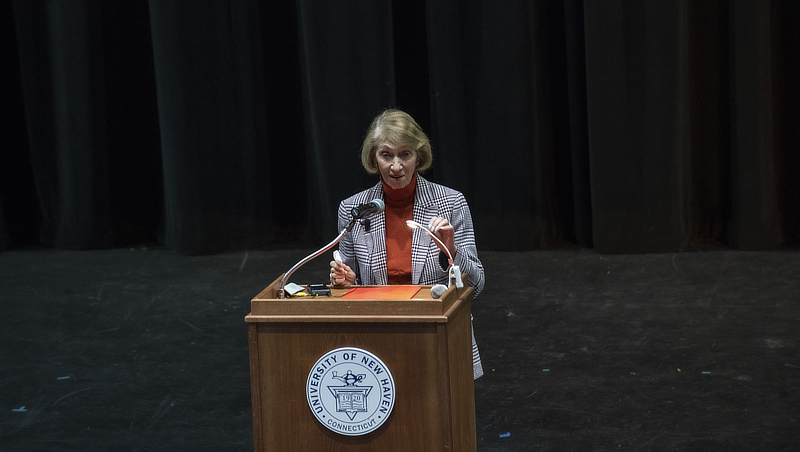 Holocaust survivor Eva Brust Cooper speaks to the University community as part of the ceremony.