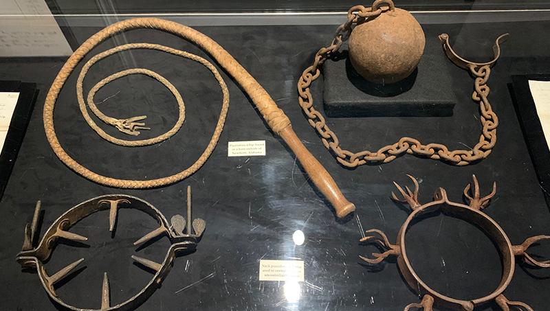 A whip and restraints that were used on slaves.