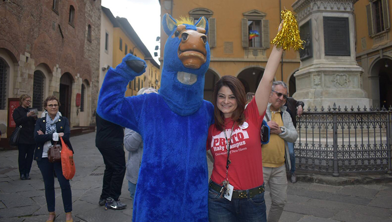 Image of Valentina Seffer, Ph.D. showing her Charger Pride in Prato.