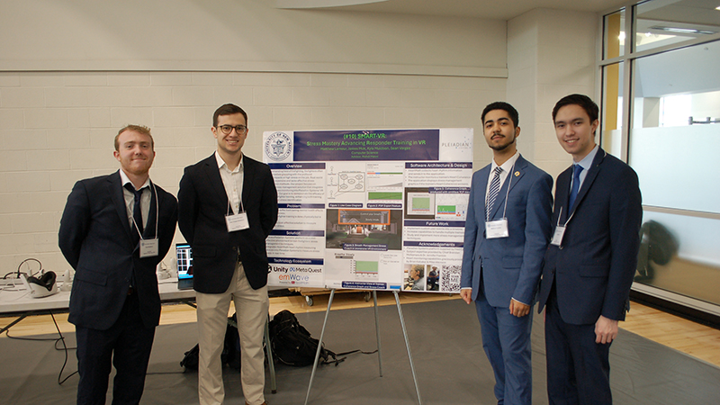 Left to right: Kyle Muldoon ’24, Sean Vargas-Altamirano ’24, Matthew Lamour ’24, and James Mok ’24 present their senior capstone project at the University. 