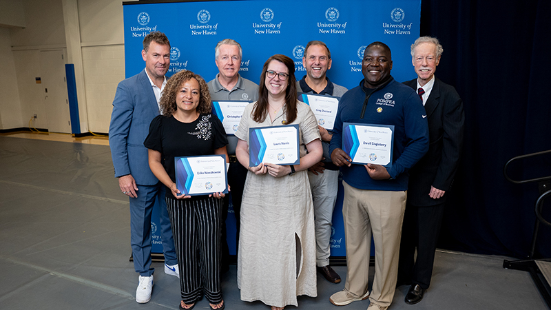 President Jens Frederiksen, Ph.D., and Philip H. Bartels ’11 Hon., (far right) join some of the Bartels Service Award recipients: Erica Nowakowski; Chris Reed; Laura Norris; Greg Overend; Darell Singleterry.